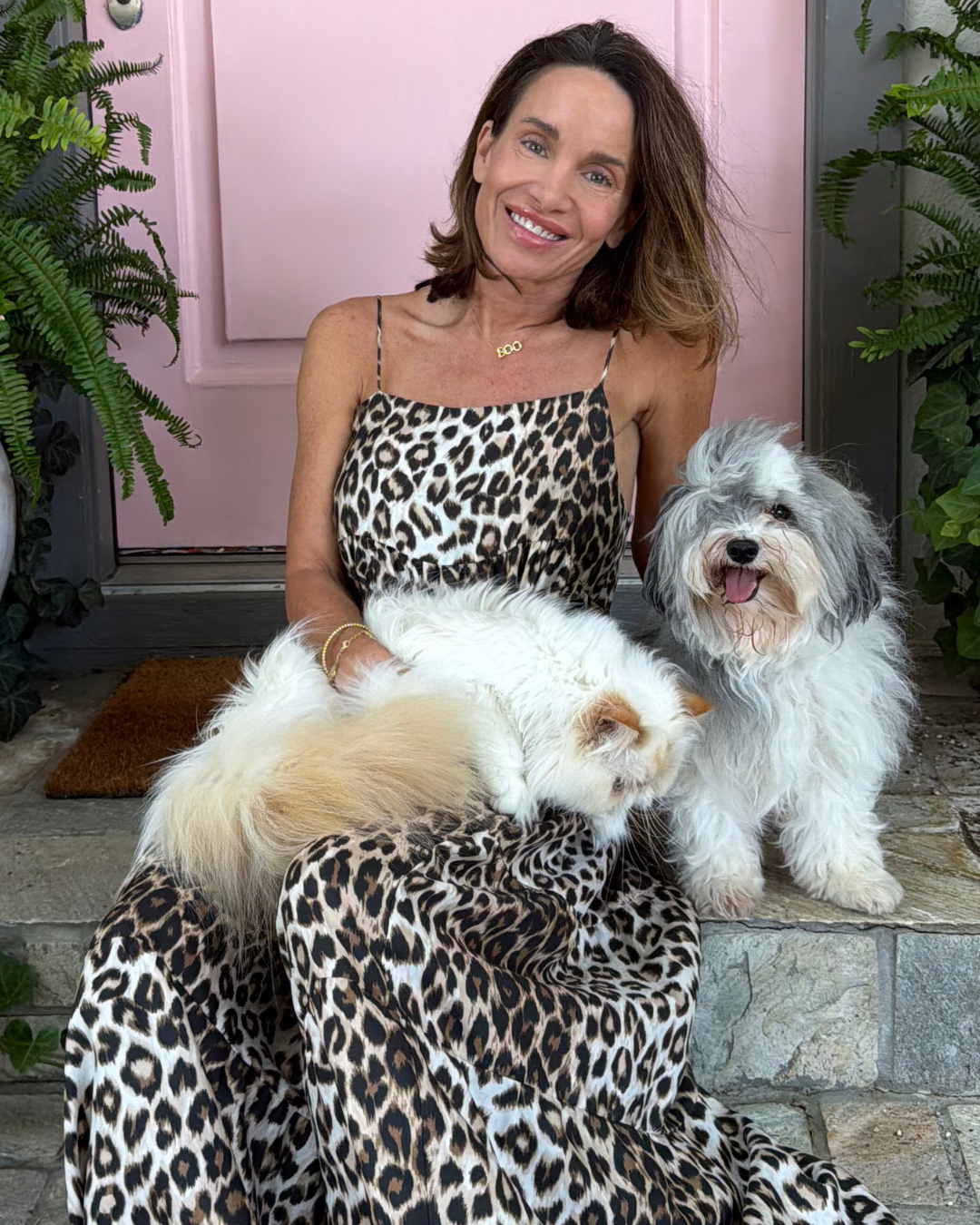 Jenny Wilson seated with her two dogs